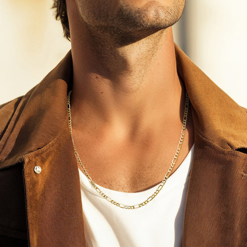 10k yellow gold figaro-link chain necklace worn at the collar