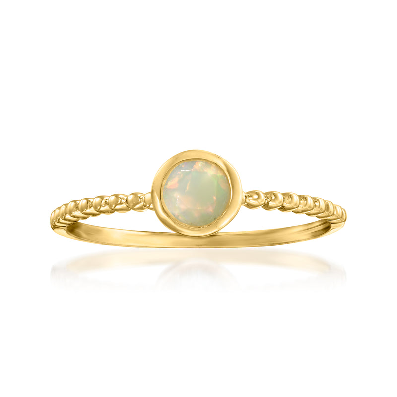 14kt yellow gold opal ring with round iridescent stone and braided band