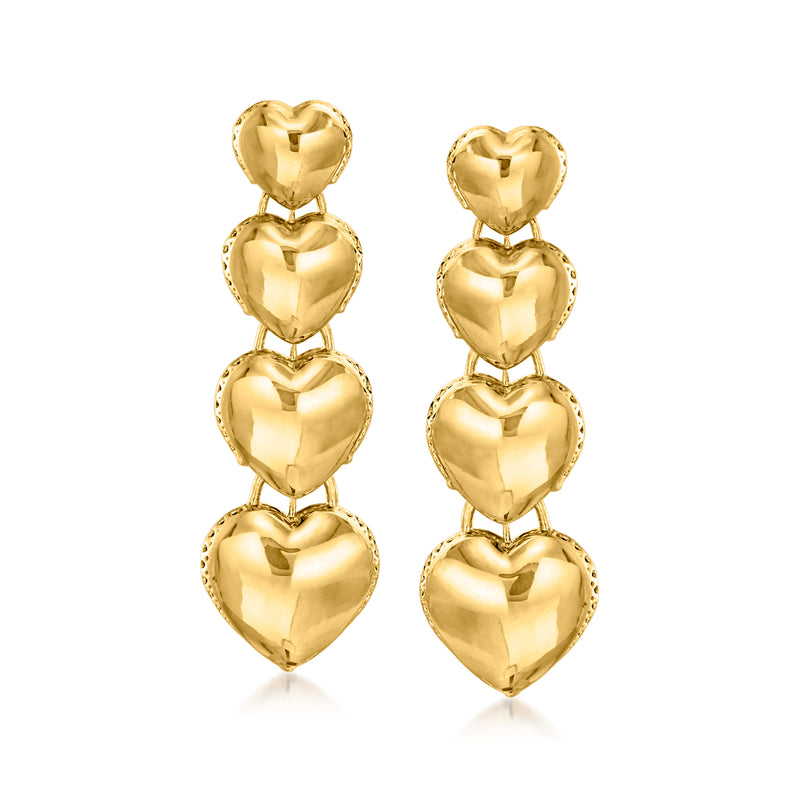 Gold heart drop earrings with four graduated heart charms on a hinged drop