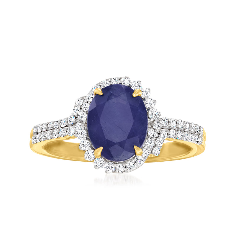 14kt yellow gold ring with oval dark-blue sapphire center and diamond halo