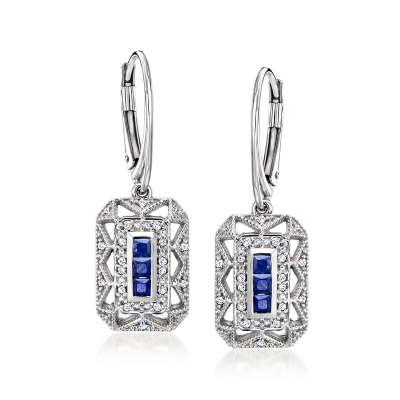 Sterling silver drop earrings with sapphire center stones and diamond halo, leverback.