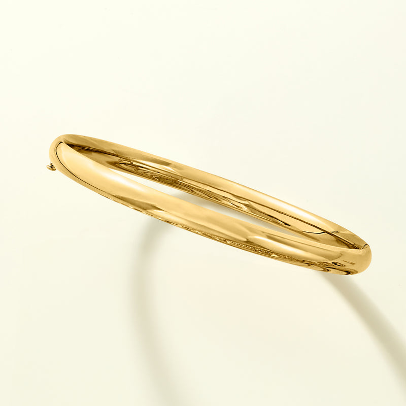 Yellow gold round bangle bracelet, angled side view