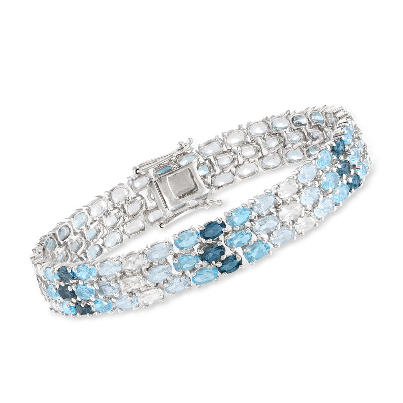 Sterling silver multi-row topaz bracelet with blue and white gemstones, hinged clasp