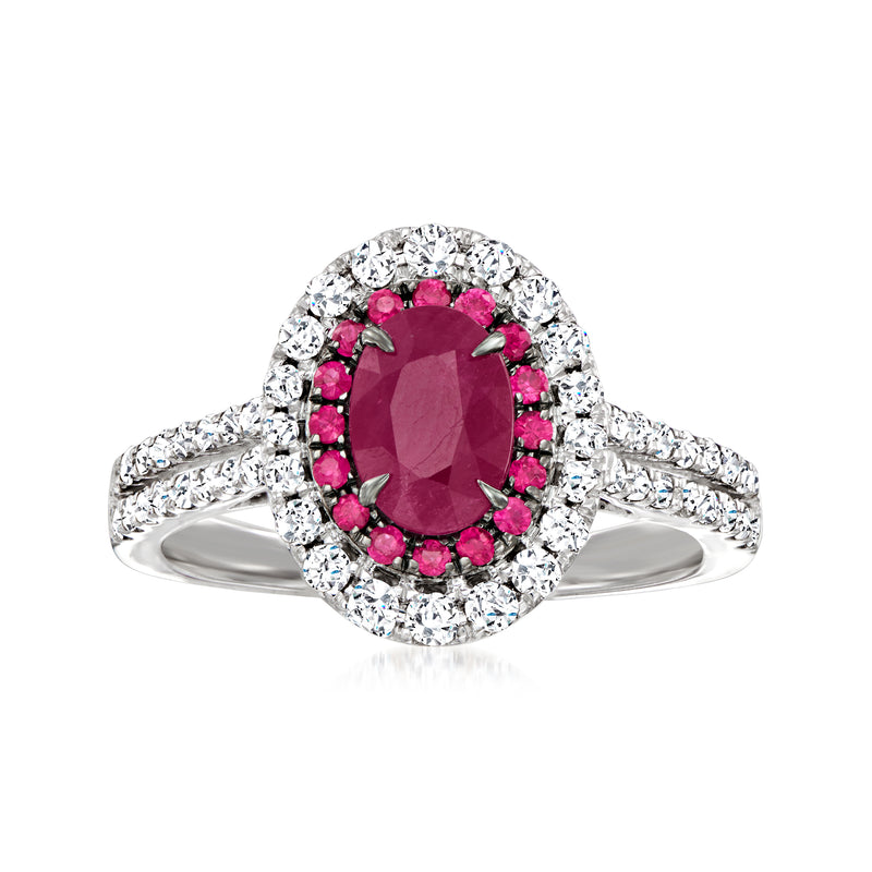 Ruby and diamond ring in 14kt white gold with oval pink center and diamond halo