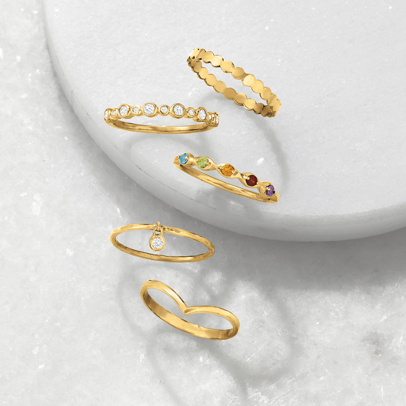Chevron gold ring with raised V motif on slim band