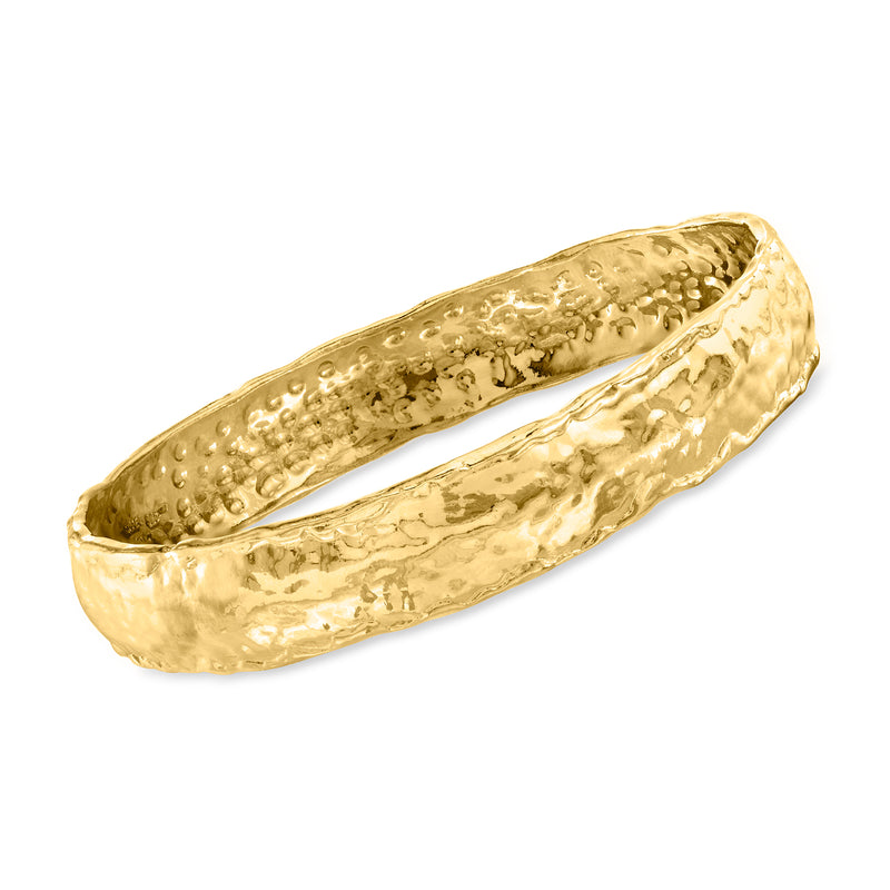 Gold over sterling hammered bangle bracelet with textured interior and curved profile