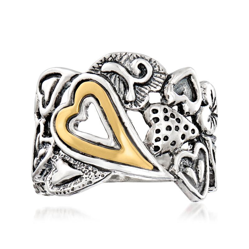 Sterling silver openwork heart ring with 14kt yellow gold center, textured setting