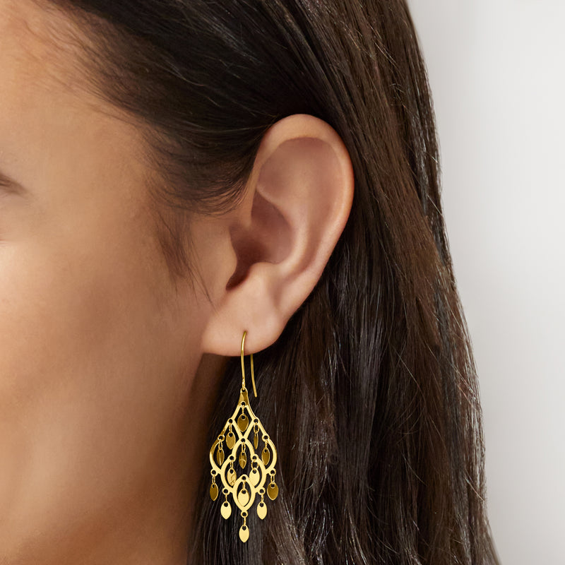 10kt yellow gold chandelier earrings on ear, ornate filigree with dangling drops
