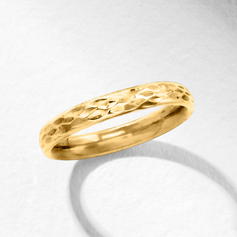 10kt yellow gold textured ring with faceted hammer pattern on top, smooth inside.