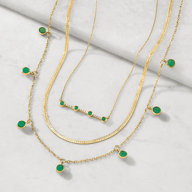 14kt yellow gold herringbone necklace with green round bead accents