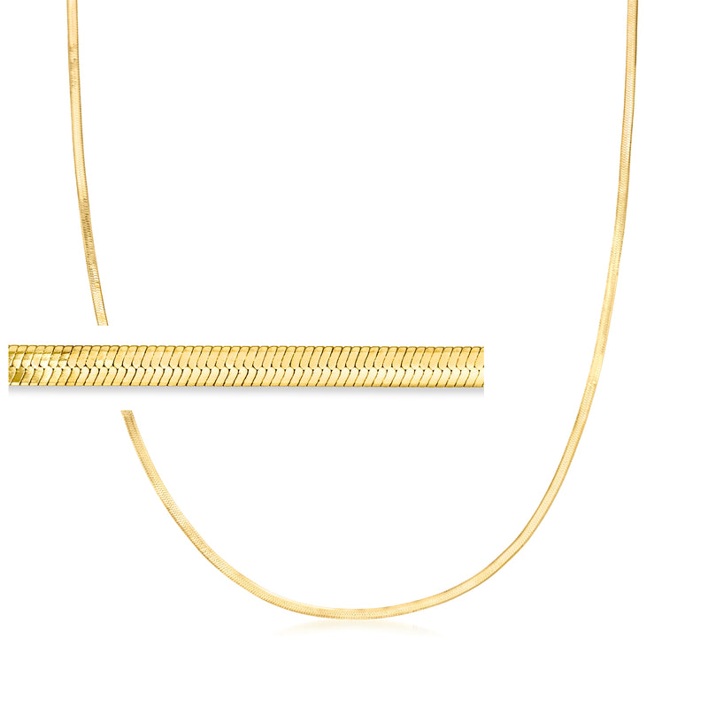 Gold herringbone link necklace with slim chain, shown near clasp