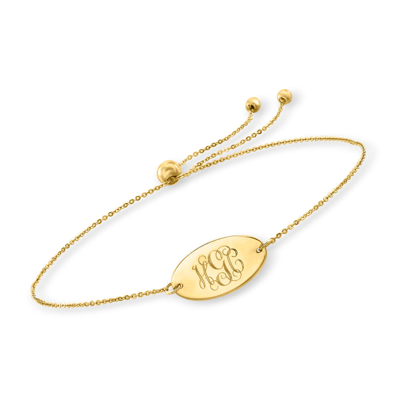 14kt yellow gold bolo bracelet with oval engraved monogram charm