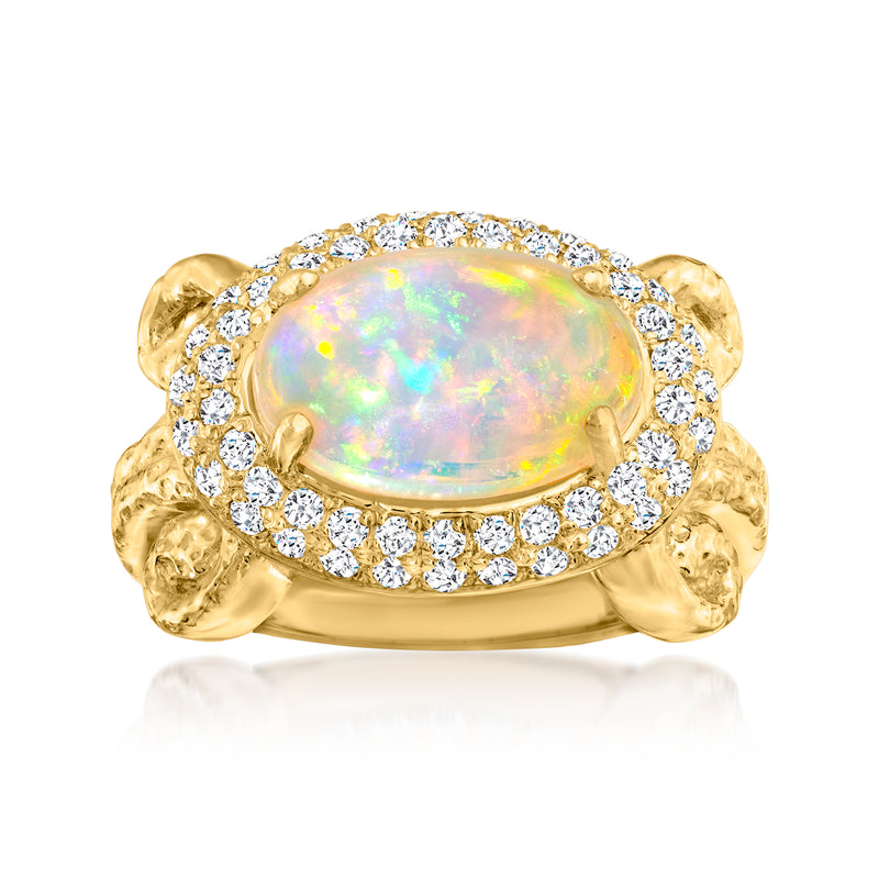 14kt yellow gold ring with oval opal center and diamond halo, twisted side accents
