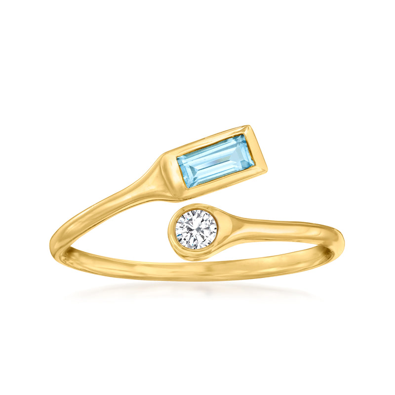 14kt yellow gold bypass ring with rectangular blue topaz and round diamond accent