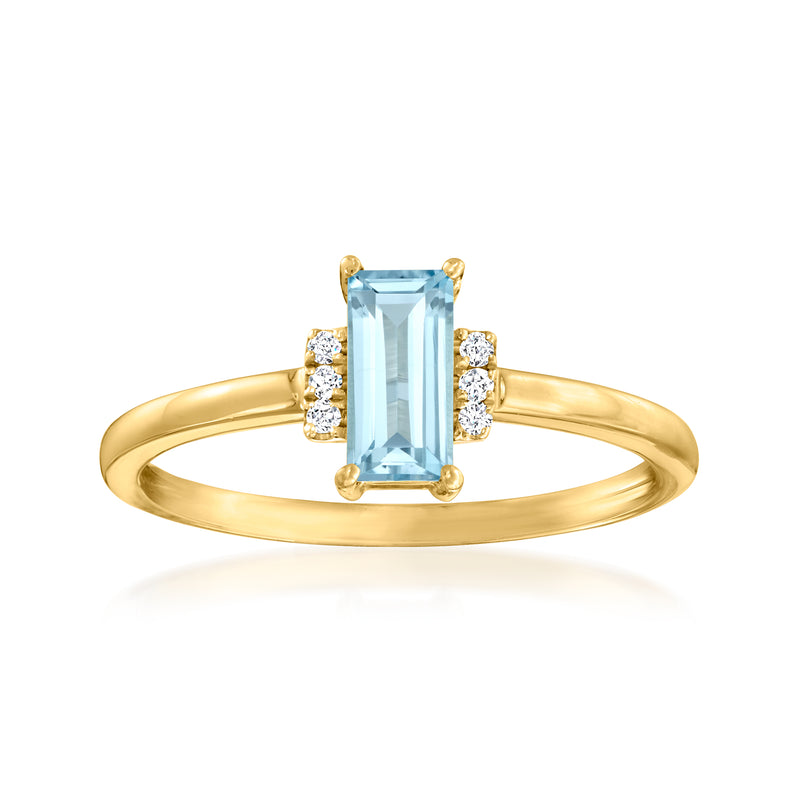 14kt yellow gold ring with blue topaz center and four diamond accents