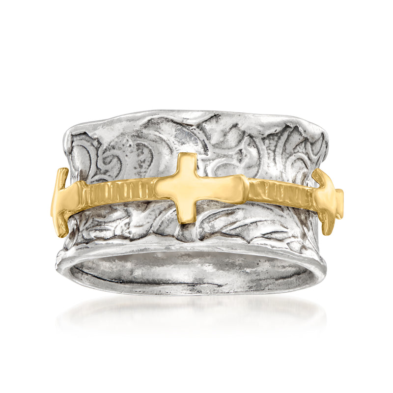 Two-tone silver and gold cross spinner ring with textured band and gold cross centerpiece.