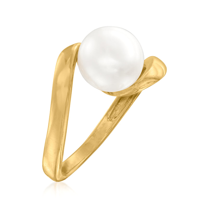 Twisted gold-tone ring with large white pearl, side view