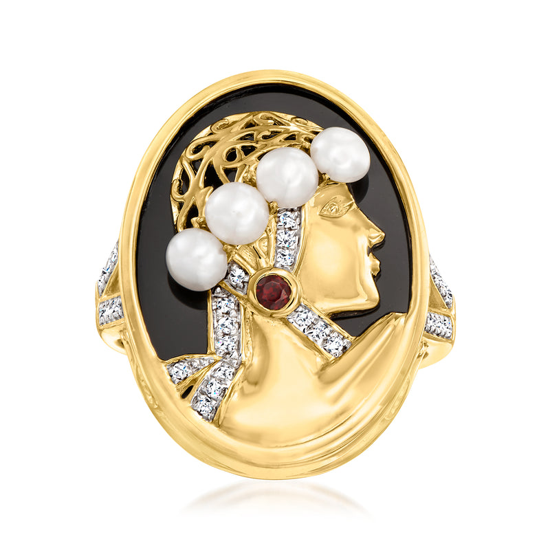 Gold-tone cameo-style ring with black oval stone, three white pearls, and red gem accents