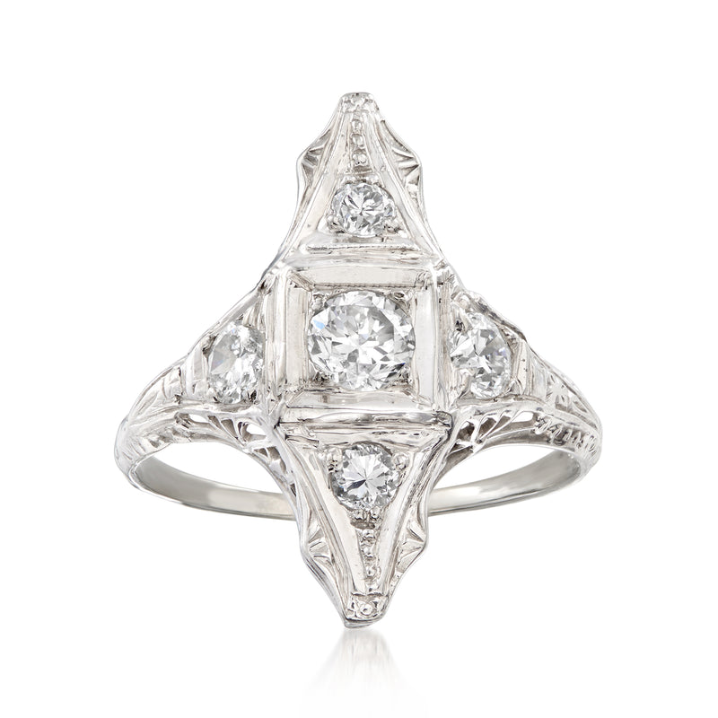 Vintage diamond filigree dinner ring in 18k white gold with central round stone