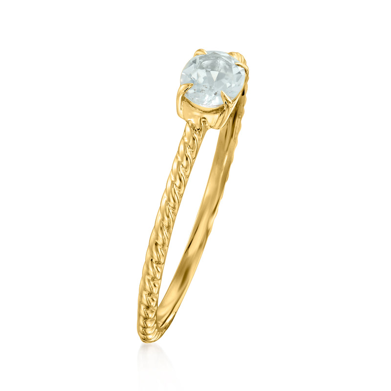 Yellow gold roped band ring with oval aquamarine center stone and prong setting