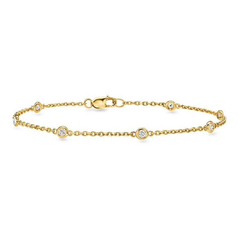 Gold diamond station bracelet with round bezel-set stones, adjustable clasp