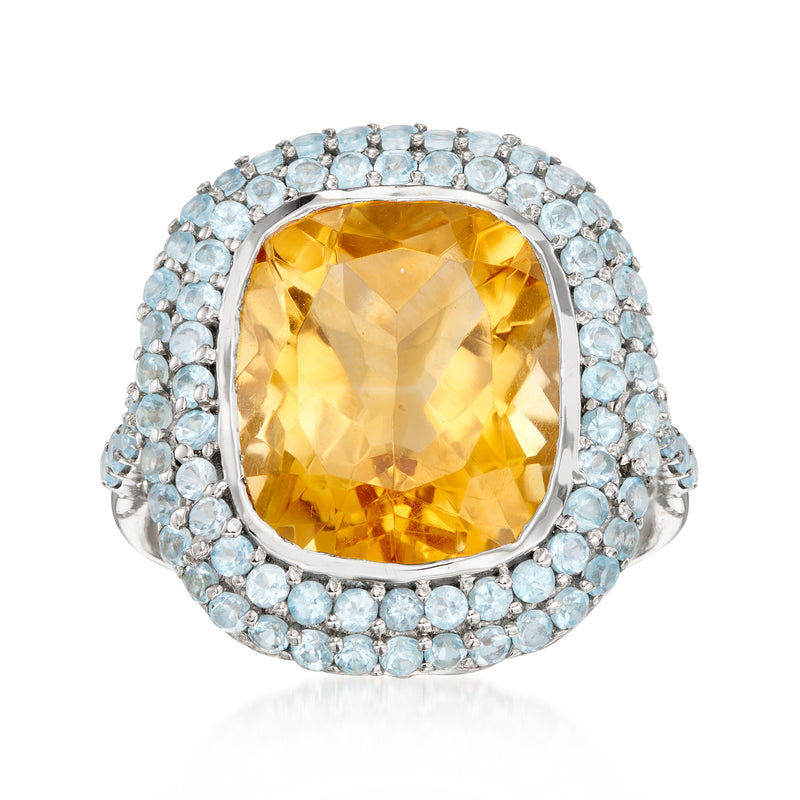 Sterling silver ring with cushion citrine centerpiece and sky blue topaz halo setting