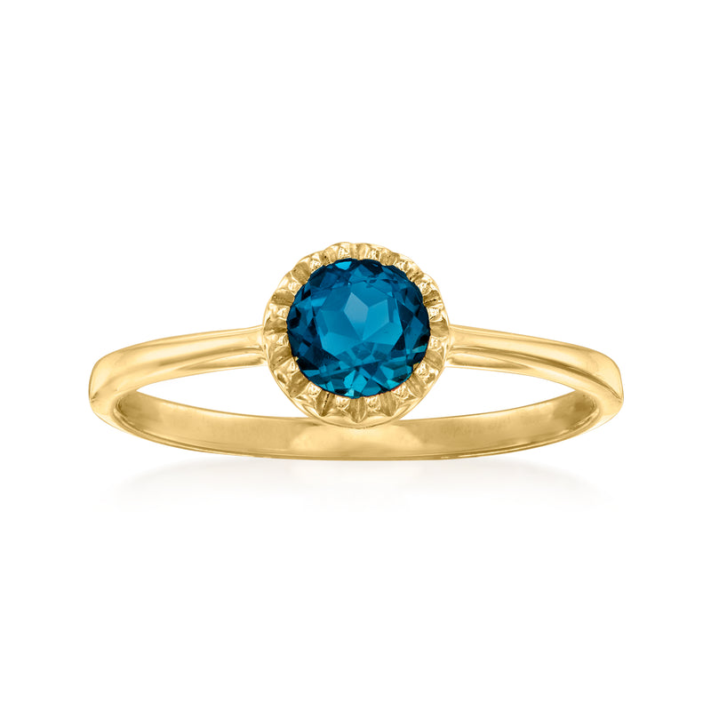 10kt yellow gold ring with round London blue topaz center and halo bezel setting