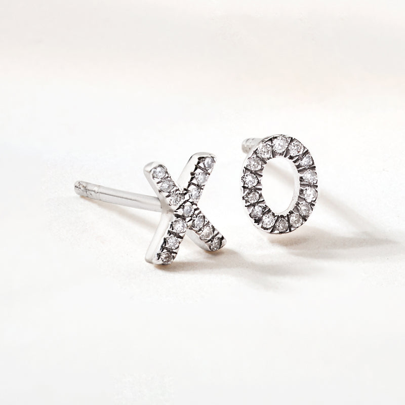 Sterling silver diamond XO mismatched post earrings, X stud and O halo detail
