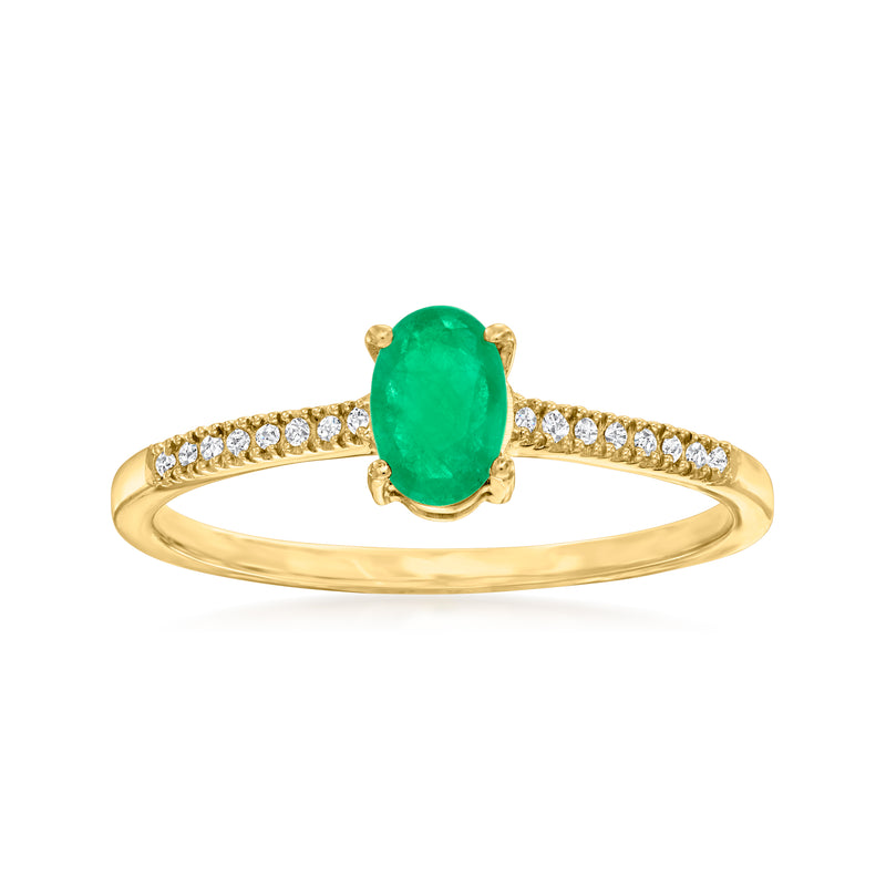 10kt yellow gold ring with oval emerald center and diamond accents on the band