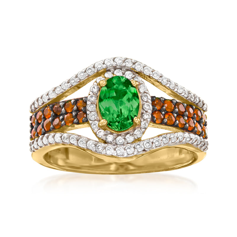 Gold ring with oval green center stone, orange accents, and white zircon halo