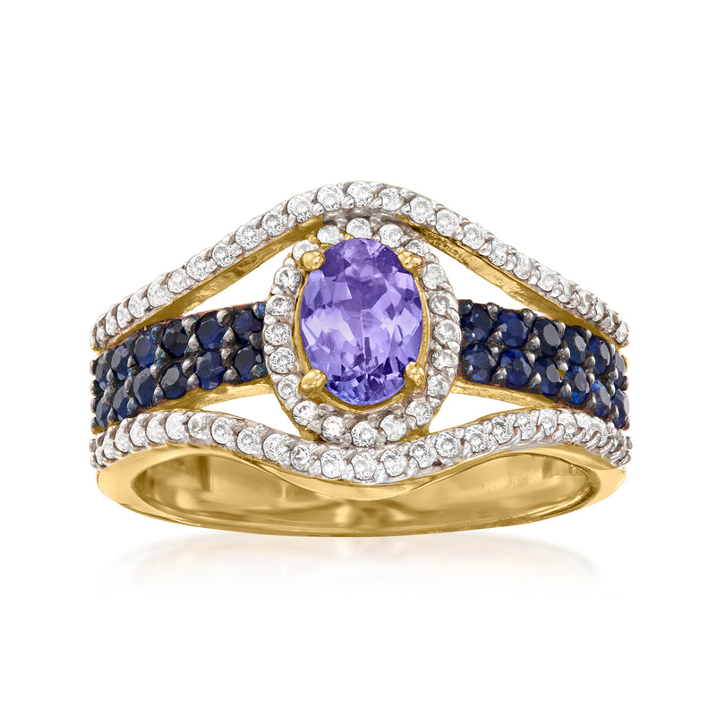 Two-tone gold ring with oval purple center, clear halo, blue sapphire band