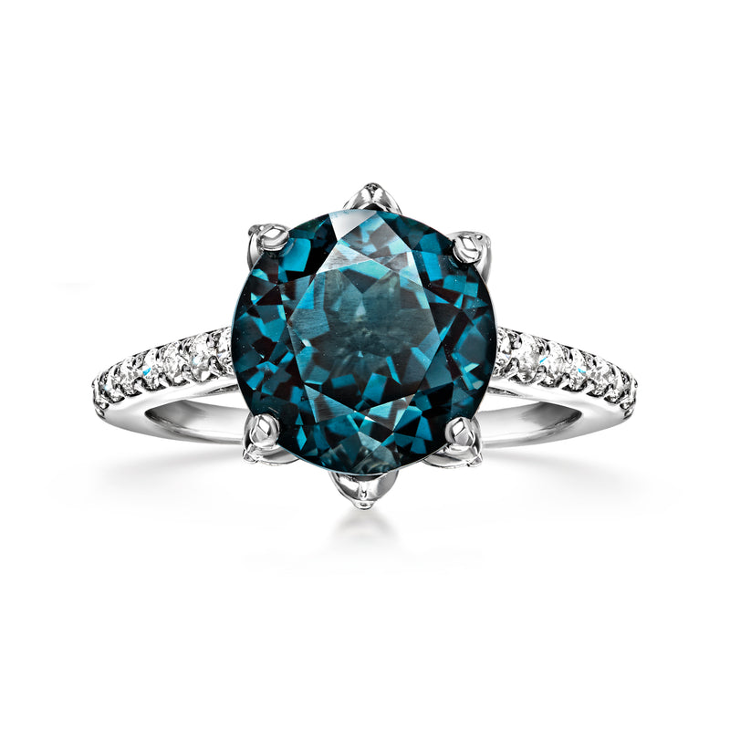 18kt white gold ring with oval London blue topaz and diamond accents, prong set