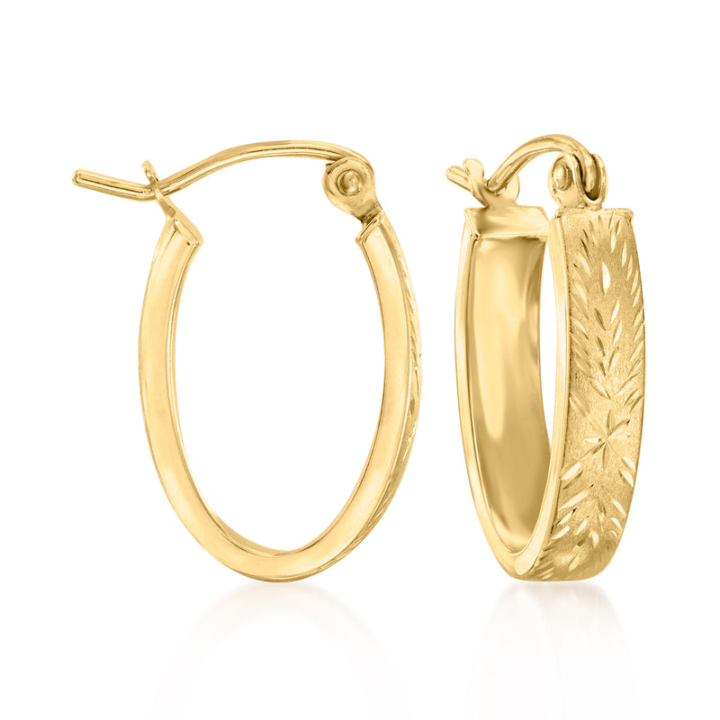Oval yellow gold-tone hoop earrings with patterned face and hinged back