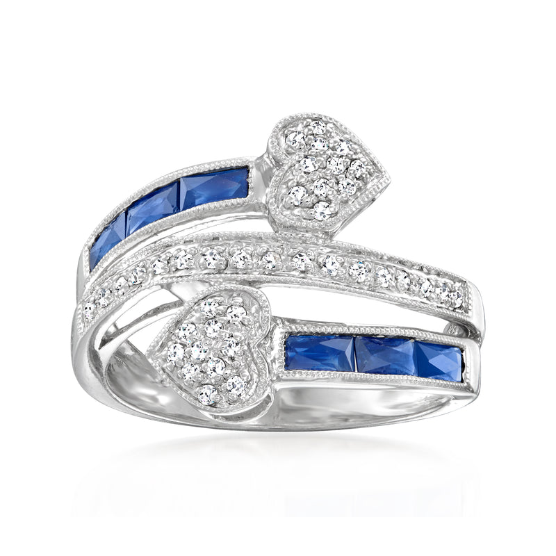 14kt white gold heart bypass ring with blue sapphires and diamond accents