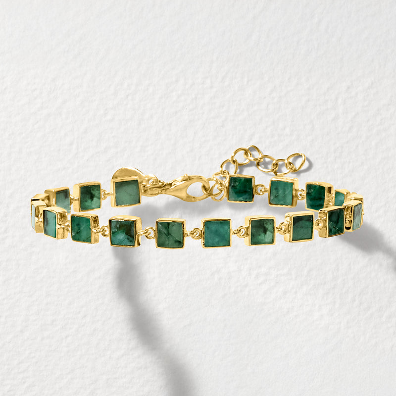 Gold over sterling bracelet with square teal stone links