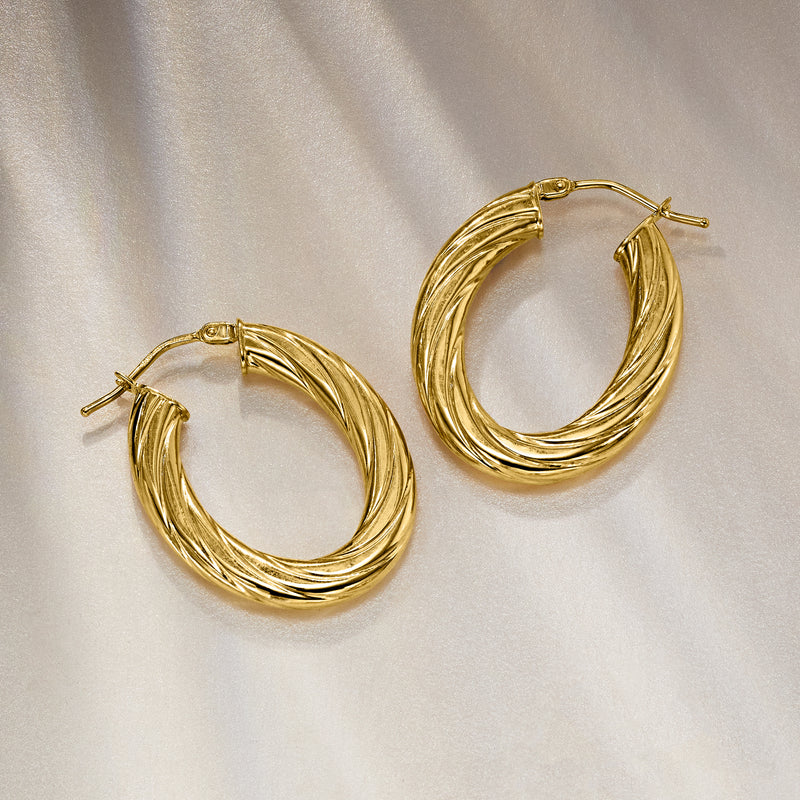 Italian 10kt yellow gold twisted oval hoop earrings, angled view with back posts.