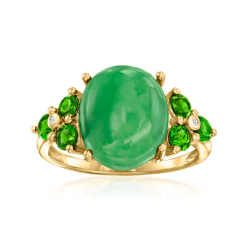 Gold-tone ring with oval green gemstone center, green side stones, and clear zircon accents