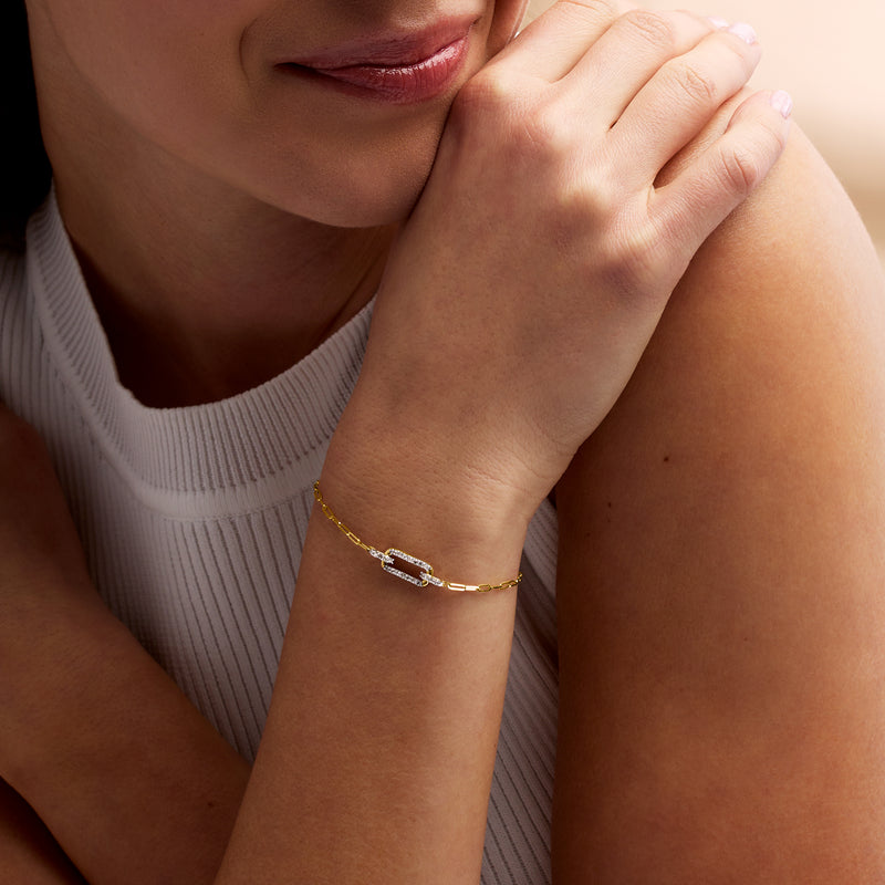 14kt yellow gold bracelet with diamond paper clip link on wrist