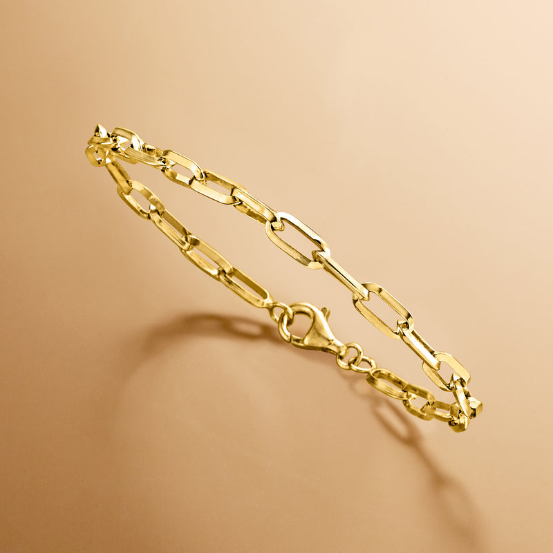 Gold paper clip link bracelet, angled view, visible oval clasp and chain links