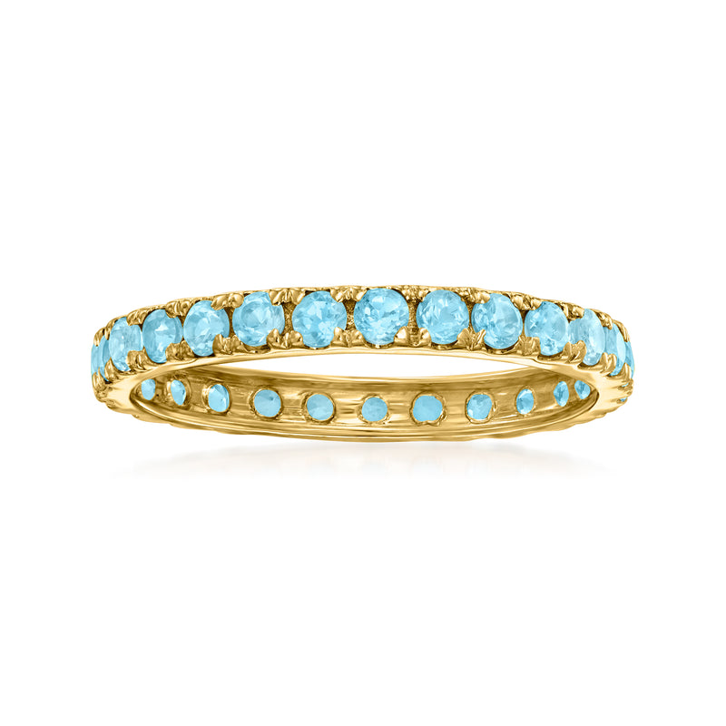 14kt yellow gold eternity band with Swiss blue topaz round stones