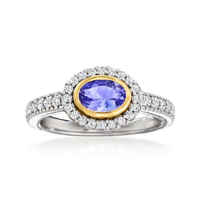 Tanzanite and white zircon ring with oval blue gemstone, yellow-gold bezel on silver band