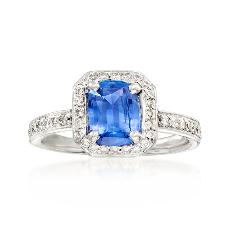 Platinum sapphire ring with diamond halo and pavé band