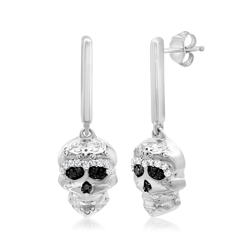 Sterling silver skull drop earrings shown from side with black diamond eye accents