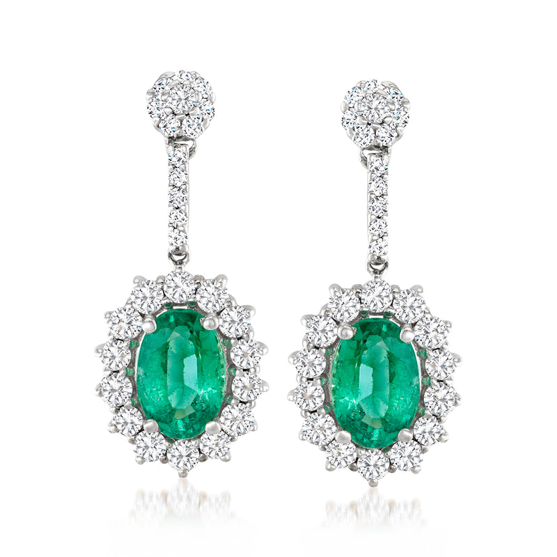 Emerald and diamond drop earrings with oval green emerald and round diamond halo, white gold