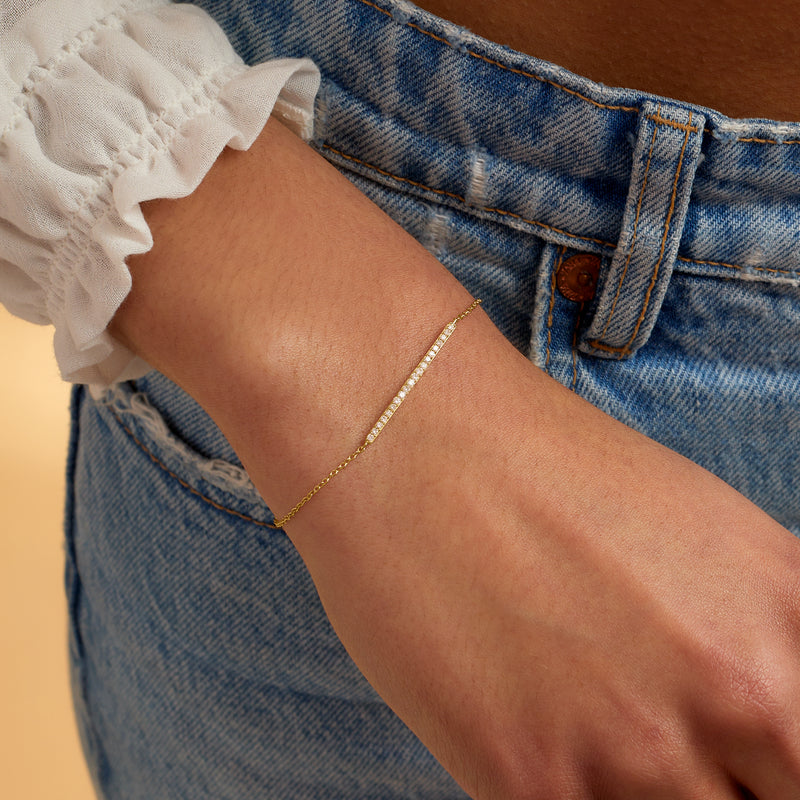 14kt yellow gold diamond bar bracelet on wrist