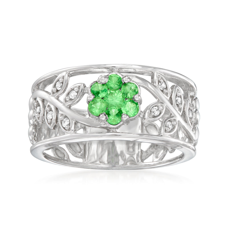 Vintage tsavorite flower ring in 9kt white gold, green center with diamond accents