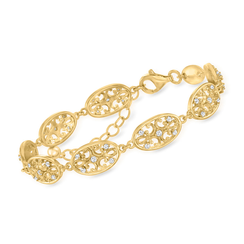 Gold-tone filigree oval-link bracelet with clear stones and toggle clasp