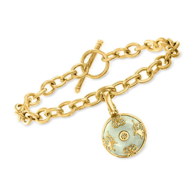Gold-tone chain bracelet with round removable pendant charm featuring butterfly motifs