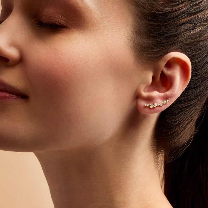 14kt yellow gold diamond leaf ear climber earrings worn on side-profile model