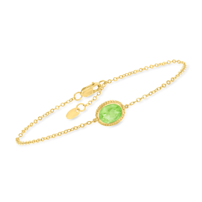14kt yellow gold bracelet with oval peridot center stone and spring-ring clasp